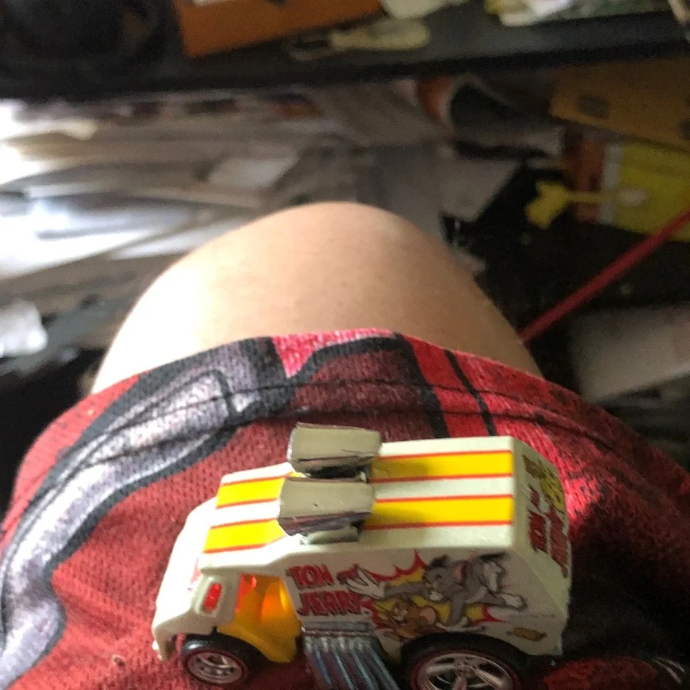 Vintage Toy Car with Yellow & Orange Racing Stripes